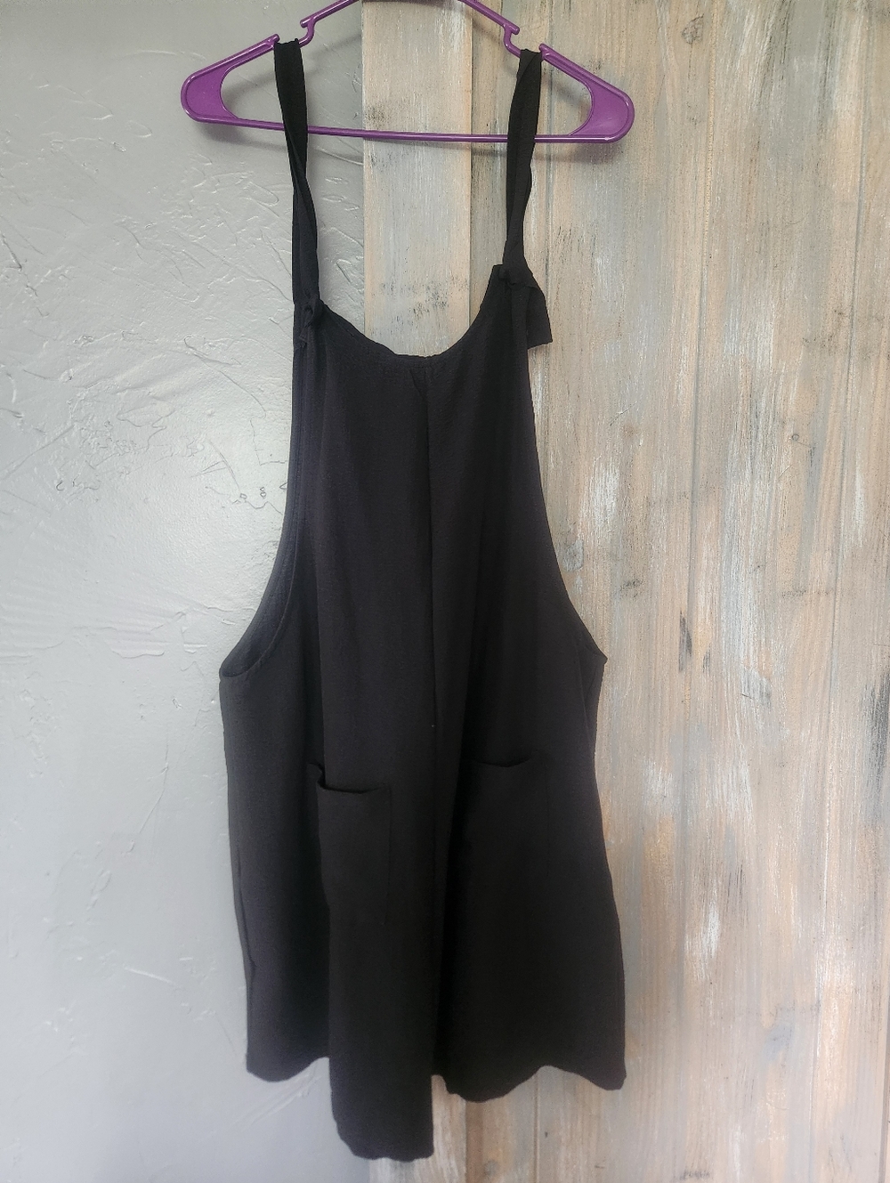 Black Sleeveless Romper with Front Pockets
